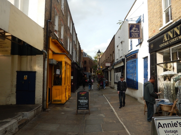 Camden Passage - close by near Angel on Upper Street - has quite a few antique shops and is worth a mooch...