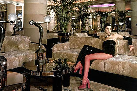 Twiggy sits in the Rainbow Room surrounded by Biba lamps