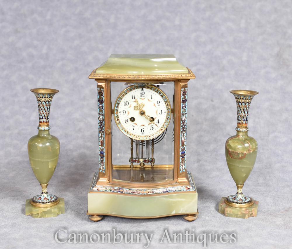 Onyx garniture set flanking the antique clock in the middle