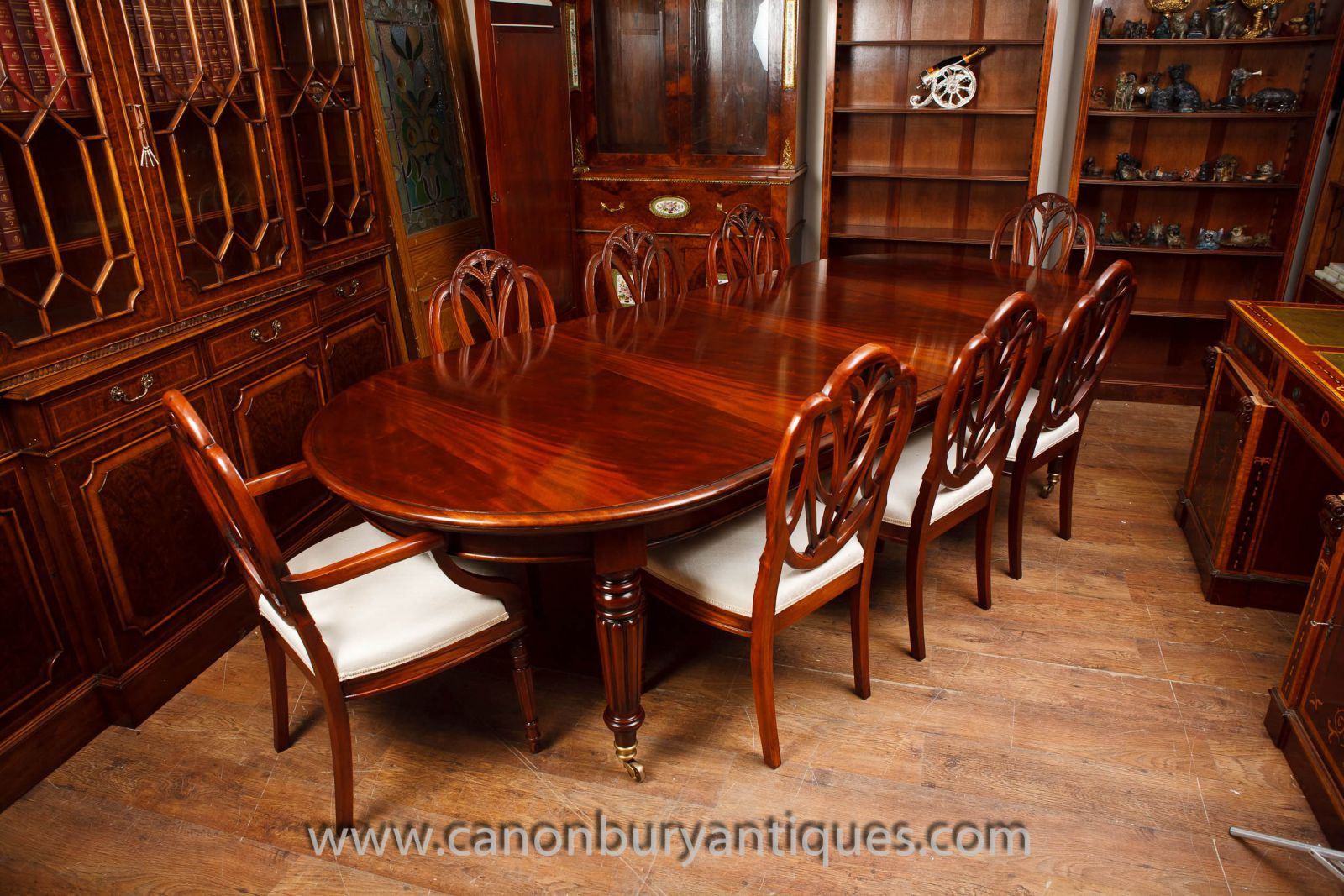 Flame mahogany table with set of Hepplewhite chairs to match