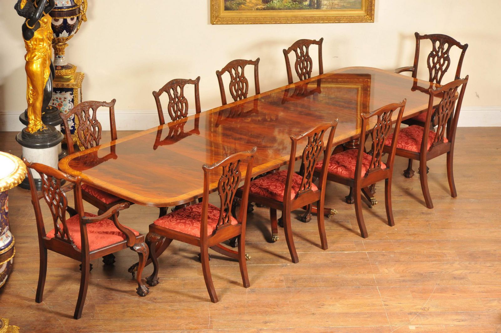 Flame mahogany Regency table and matching set of Chippendale chairs