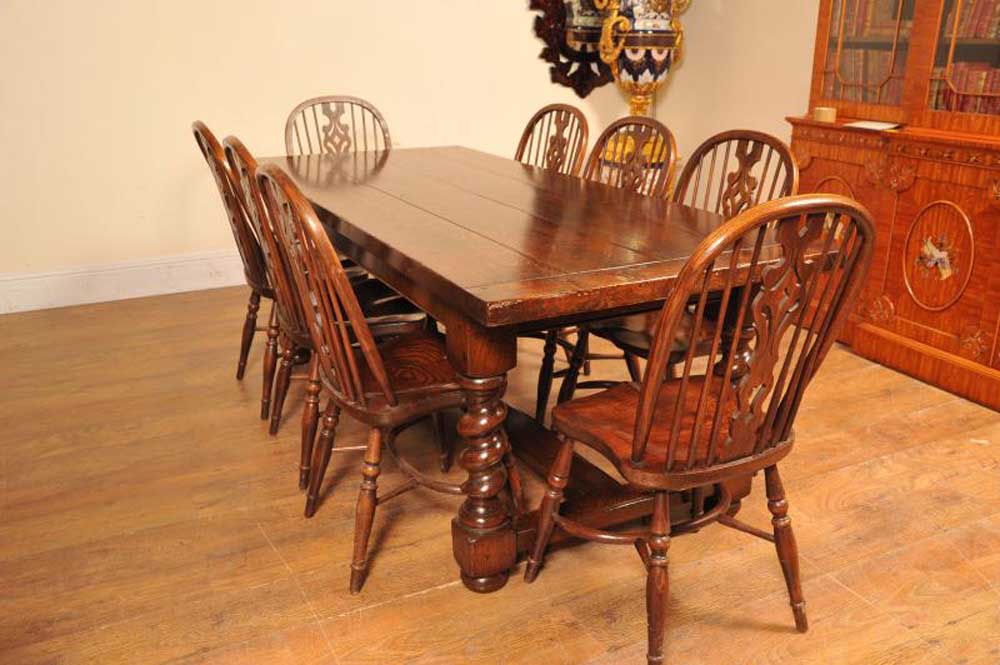 Set of oak Windsors around a matching refectory table with barley twist legs